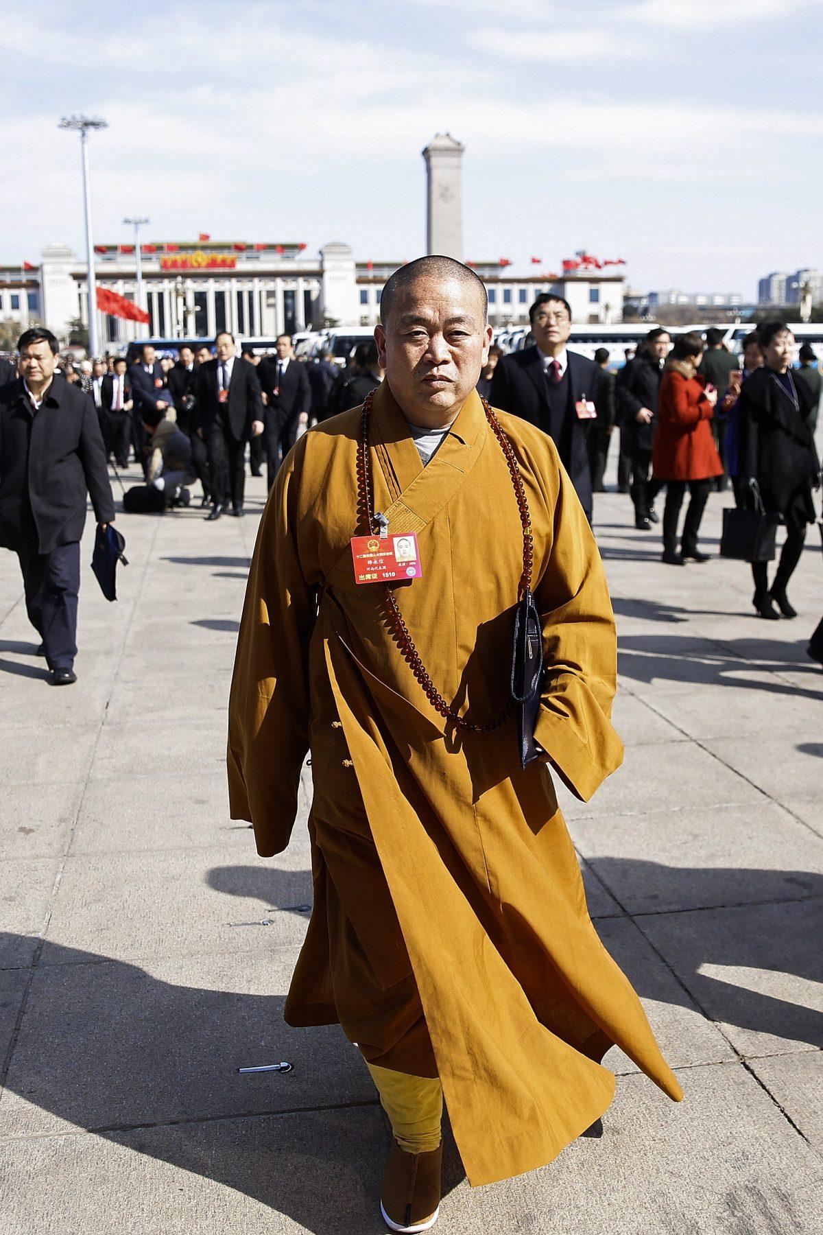 Shi Yongxin, abbot of Shaolin Temple, arrives for a session of the National People's Congress in Beijing on March 9, 2016. (Lintao Zhang/Getty Images)