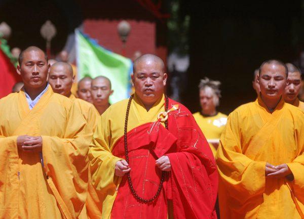 Shi Yongxin (center) attends the Chinese Kungfu Star TV Contest held at Shaolin Temple on Sept. 9, 2006. (China Photos/Getty Images)