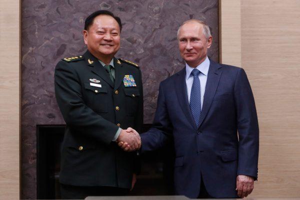 Russian President Vladimir Putin (R) meets with China's Central Military Commission Vice Chairman Zhang Youxia at the Novo-Ogaryovo state residence outside Moscow on Dec. 7, 2017. (Sergei Karpukhin/AFP/Getty Images)