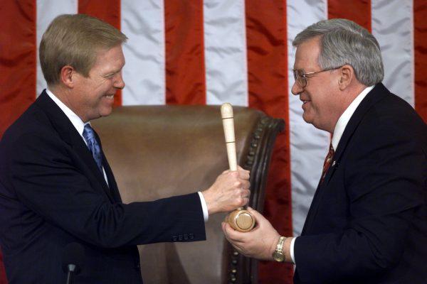 Congressman Richard Gephardt(D-Mo.) (L) hands the House gavel to Dennis J. Hastert (R-Ill.), newly sworn-in speaker of the House of Representatives on Jan. 6, 1999, during the opening session of the House on Capitol Hill in Washington. (Paul J. Richards/AFP/Getty Images)