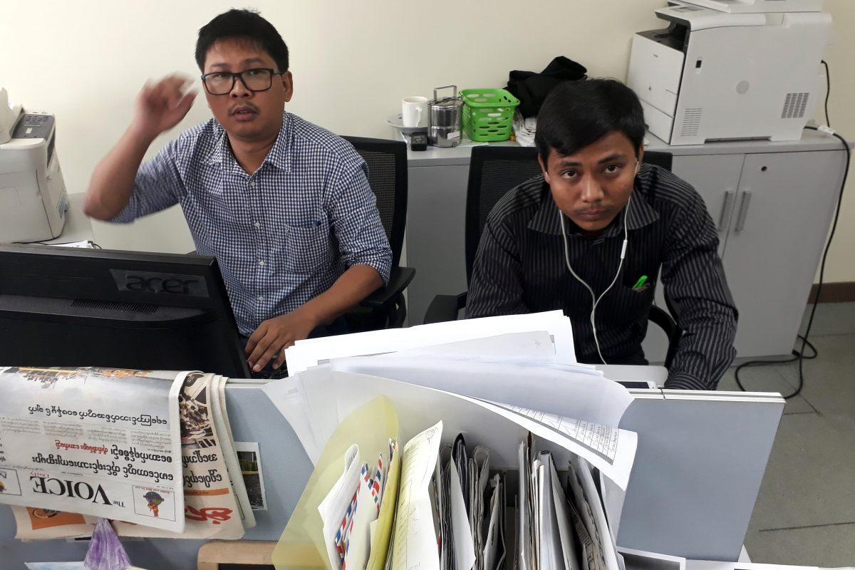 Reuters journalists Wa Lone (L) and Kyaw Soe Oo, who are based in Burma, pose for a picture at the Reuters office in Burma on Dec. 11, 2017. (Reuters/Antoni Slodkowski)