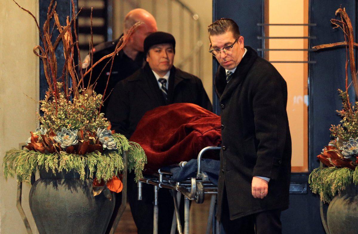 One of two bodies is removed from the home of billionaire founder of Canadian pharmaceutical firm Apotex Inc., Barry Sherman and his wife Honey, who were found dead under circumstances that police described as "suspicious" in Toronto, Ontario, Canada on Dec. 15, 2017. (Reuters/Chris Helgren)