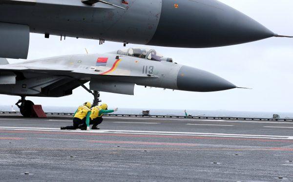This photo taken on Jan. 2, 2017, shows Chinese J-15 fighter jets on the deck of the aircraft carrier Liaoning during military drills in the South China Sea. (STR/AFP/Getty Images)