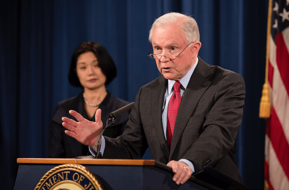 Attorney General Jeff Sessions and U.S. Attorney Jessie K. Liu for the District of Columbia at a press conference at the Justice Department in Washington on Dec. 15, 2017. (Samira Bouaou/The Epoch Times)