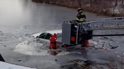 Woman Rescued After Car Plunges Into Icy Pond
