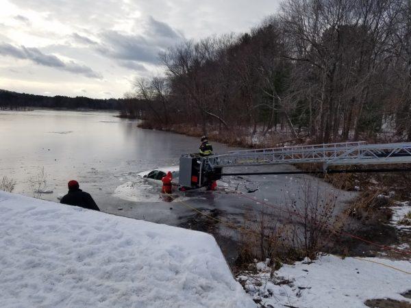 Emergency responders remove a car from Johnsons Pond, Groveland, Mass. on Dec 16. 2017 (Groveland Police and Fire Departments)