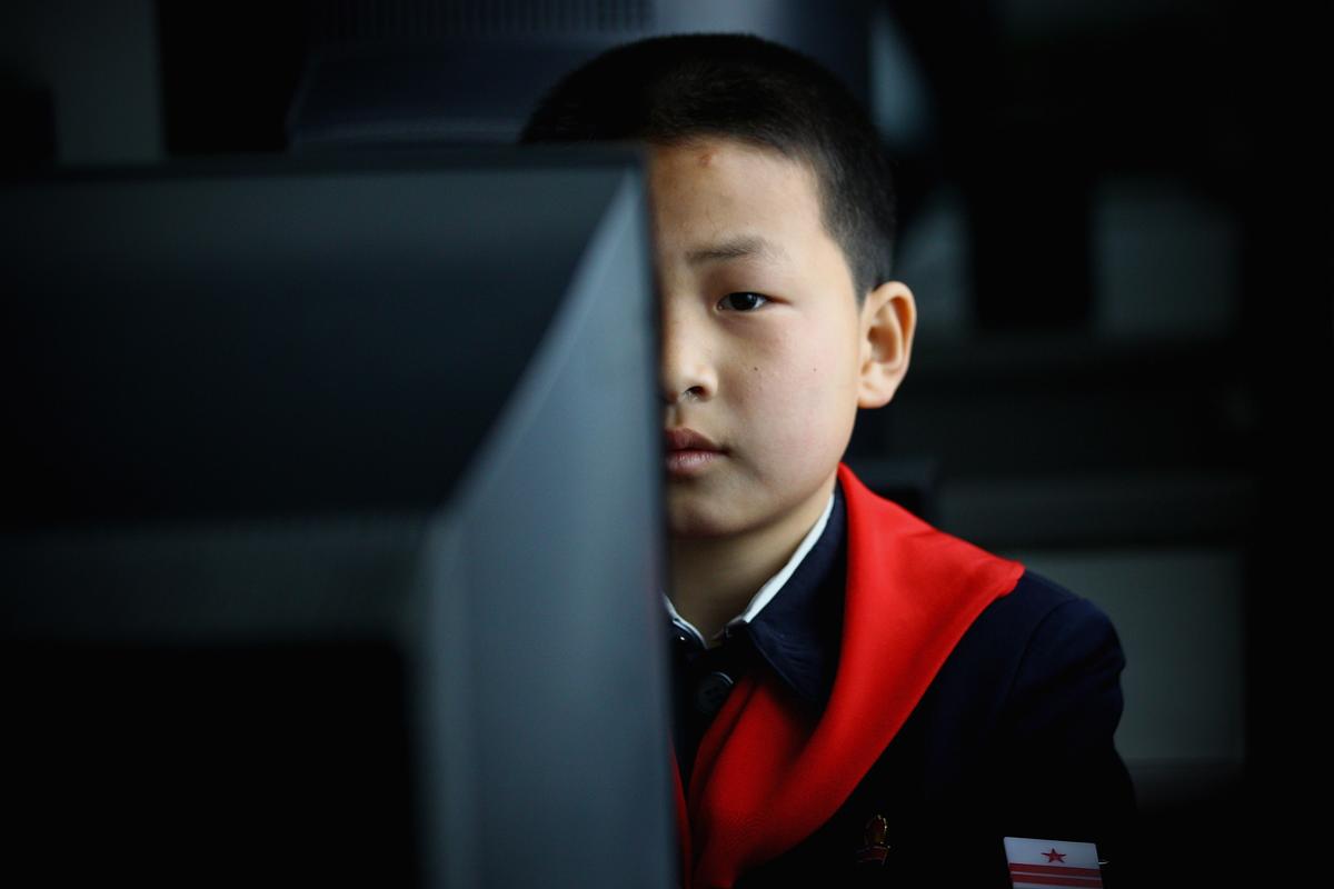 North Korean children learn to use the computer in a primary school on April 2, 2011, in Pyongyang, North Korea. The North Korean regime has placed a strong emphasis on developing cyber capabilities. (Feng Li/Getty Images)
