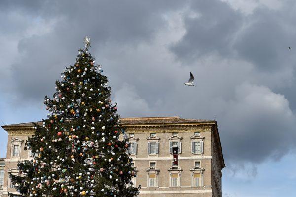 A huge Christmas tree is seen at St Peter's square as Pope Francis addresses the crowd from the window of the apostolic palace overlooking St Peter's square in Vatican on Dec. 8, 2017. (ANDREAS SOLARO/AFP/Getty Images)