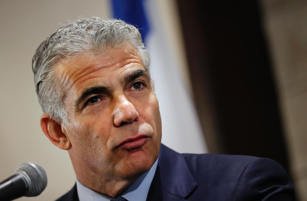 Israeli MP and chairperson of the center-right Yesh Atid party, Yair Lapid, speaks during a press conference in Jerusalem on Dec. 12, 2016. (THOMAS COEX/AFP/Getty Images)