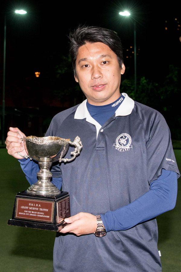 Lui Chin Hong of Craigengower Cricket Club proudly displays his Men’s Knockout Singles trophy after defeating Tony Cheung from the Hong Kong Football Club on Sunday night (Dec 17). (Panda Man/Takumi Photography)