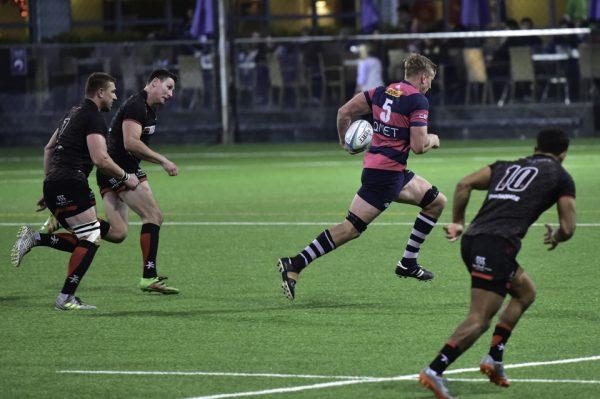 Glyn Hughes of HKFC finished a fine move created by Jervon Groves (No 5) and flyhalf Russ Webb. The score gave HKFC a deserved bonus point, and a comfortable lead 30-3 against Valley in the Premiership match at HKFC on Dec 16, 2017. (Bill Cox/Epoch Times)