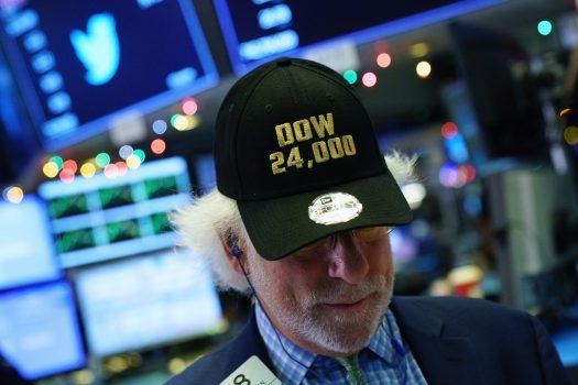 <br/>A trader wears a Dow 24,000 hat on the floor of the New York Stock Exchange on Nov. 30. The Dow closed at over 24,000 for the first time in its history that day after closing above 23,000 for the first time on Oct. 18. (Drew Angerer/Getty Images)