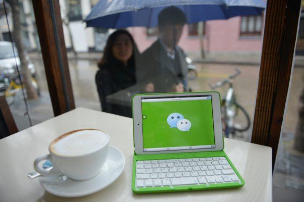 This photo shows the logo of Chinese instant messaging platform called WeChat, which was developed by the telecommunications company Tencent, on a mobile device on March 12, 2014. (Peter Parks/AFP/Getty Images)