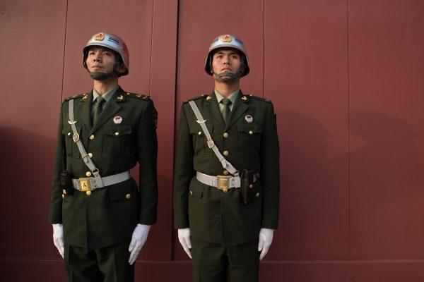 Chinese paramilitary stand near Tiananmen Square in Beijing on October 22, 2017. (NIcolas Asfouri/AFP/Getty Images)
