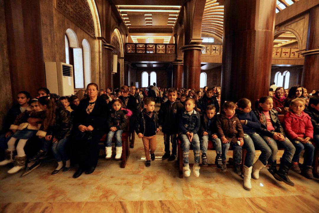 For Iraq’s Christians, a Bittersweet First Christmas Home After ISIS