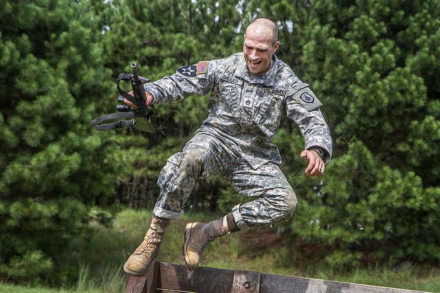 U.S. Army Staff Sgt. Russell Vidler leaps over the wall at the Fit to Win obstacle course on Fort Jackson, S.C., on Sept. 9, 2015. (U.S. Army photo by Sgt. 1st Class Brian Hamilton)