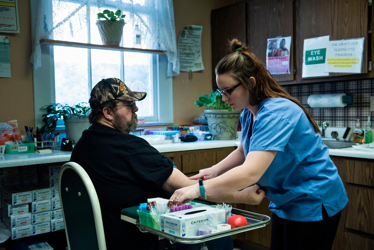 A patient has blood drawn in Burton, W.V., on March 22. (BRENDAN SMIALOWSKI/AFP/Getty Images)