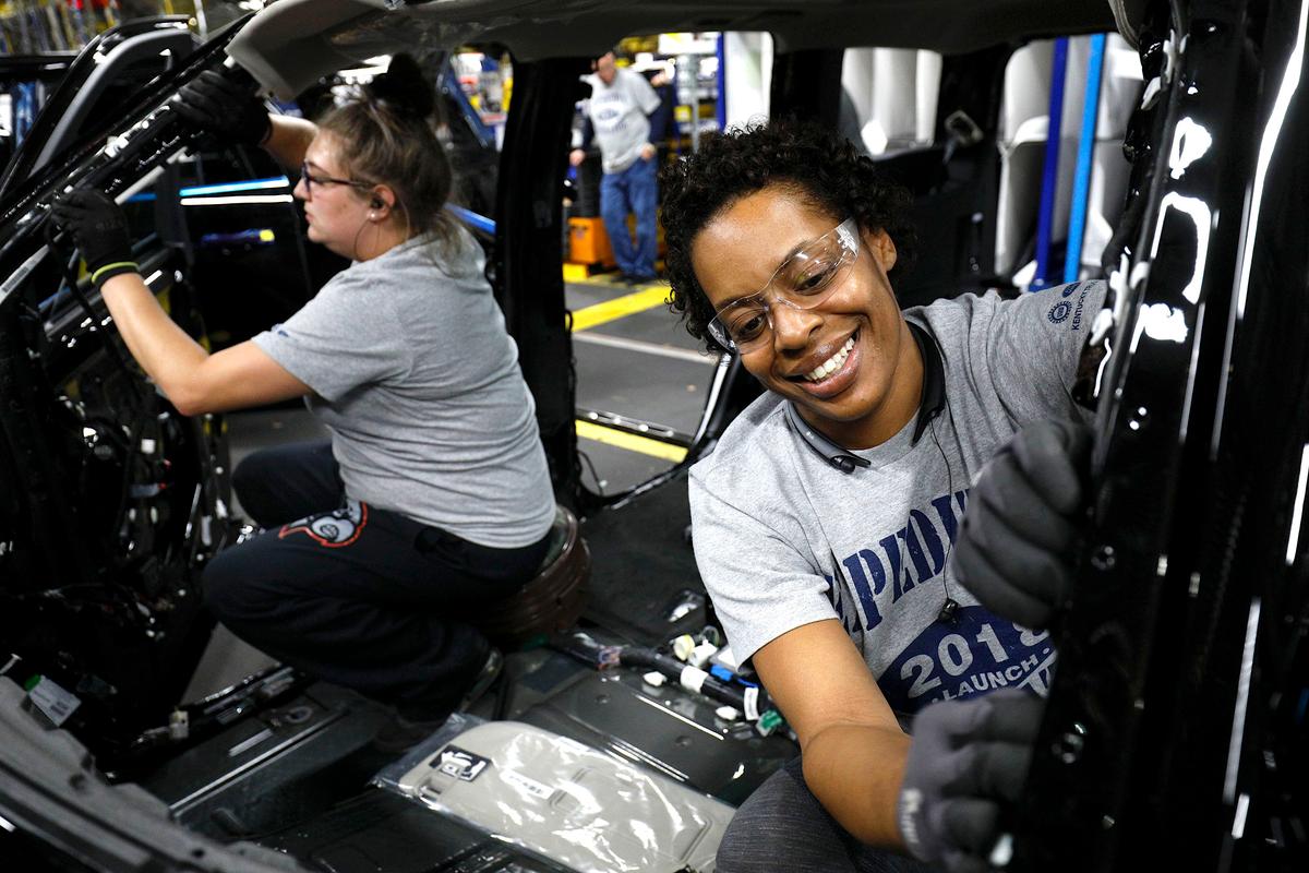 Ford workers at the assembly line at the Ford Kentucky Truck Plant in Louisville, Ky., on Oct. 27. (Bill Pugliano/Getty Images)