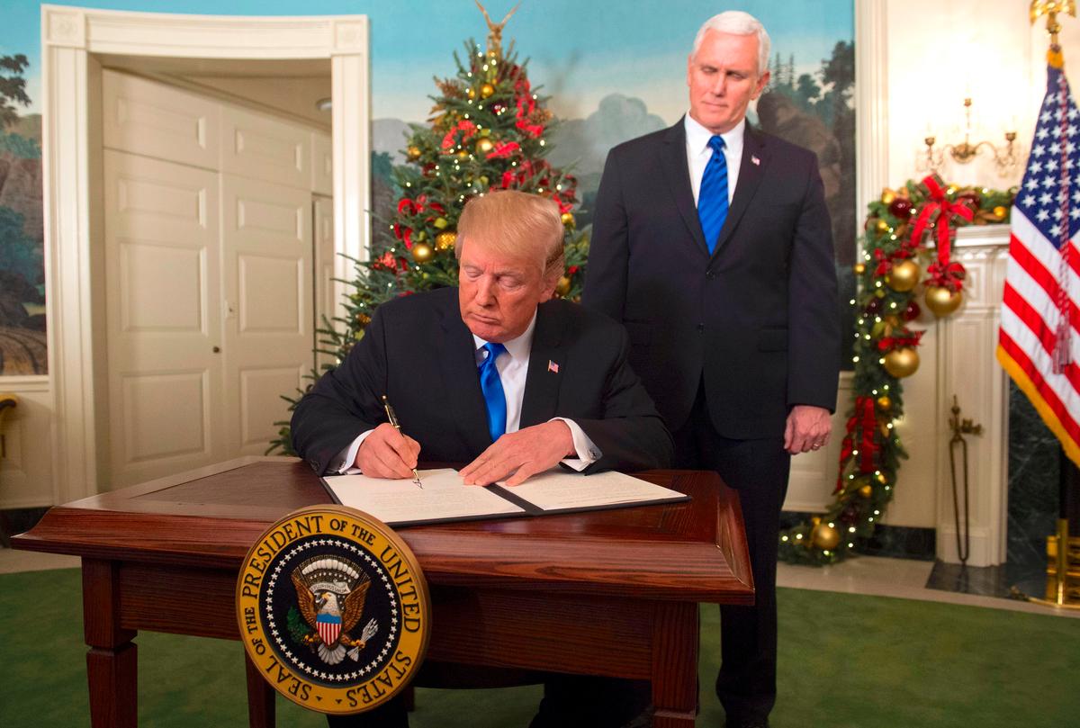 President Donald Trump signs a proclamation after delivering a statement on Jerusalem on Dec. 6, 2017. (Saul Loeb/AFP/Getty Images)