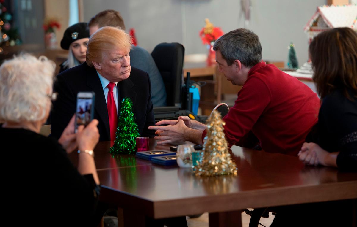 President Donald Trump meets with wounded veterans and their families at Walter Reed National Military Medical Center in Bethesda, Md., on Dec. 21, 2017. (Saul Loeb/AFP/Getty Images)