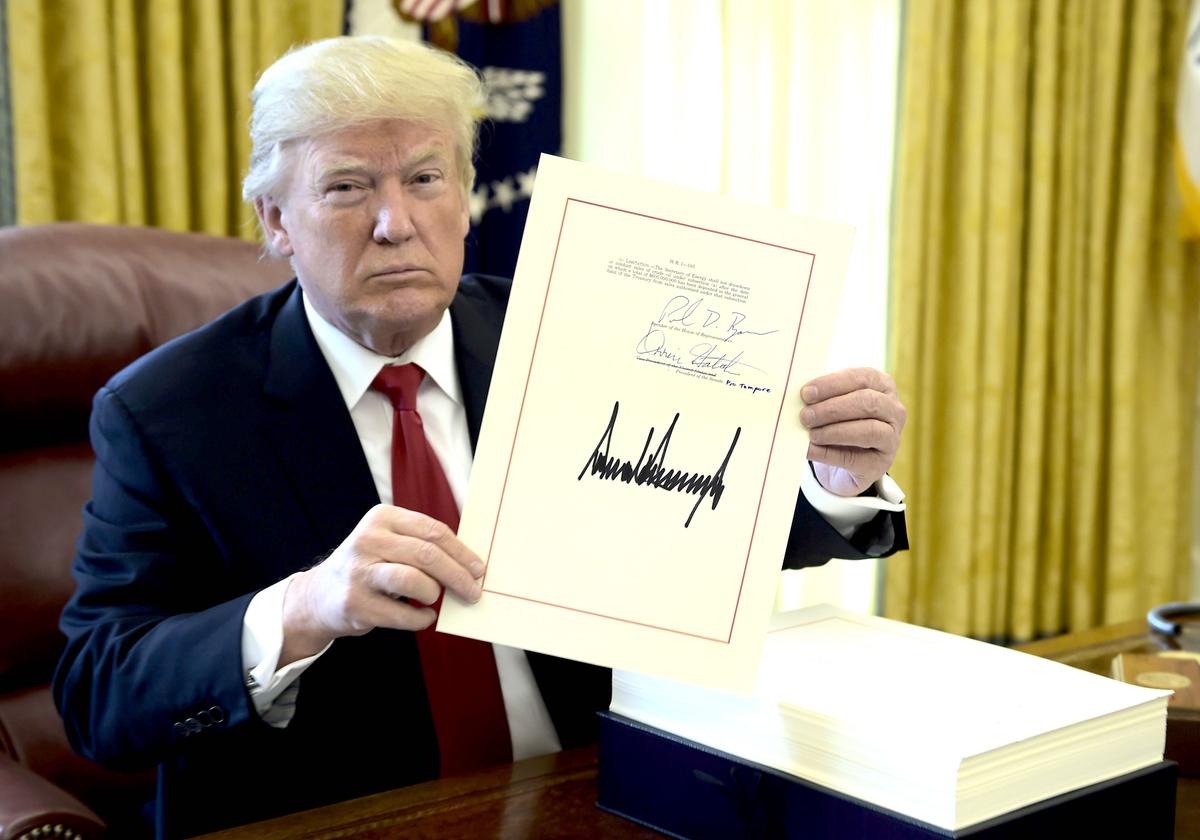 President Donald Trump during the signing event for the Tax Cut and Reform Bill, in the Oval Office at the White House in Washington on Dec. 22, 2017. (Brendan Smialowski/AFP/GETTY IMAGES)