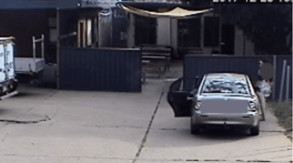The woman and one child are seen leaving the car in the hotel carpark, while an eight-year-old girl is left in the back seat. (Queensland Police)