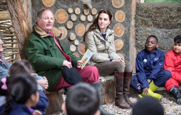 Britain's Catherine, The Duchess of Cambridge listens to children's author Michael Morpurgo read one of his stories during a visit to a "Farms for Children" farm in Gloucestershire, May 3, 2017. (Reuters/Richard Pohle/Pool)