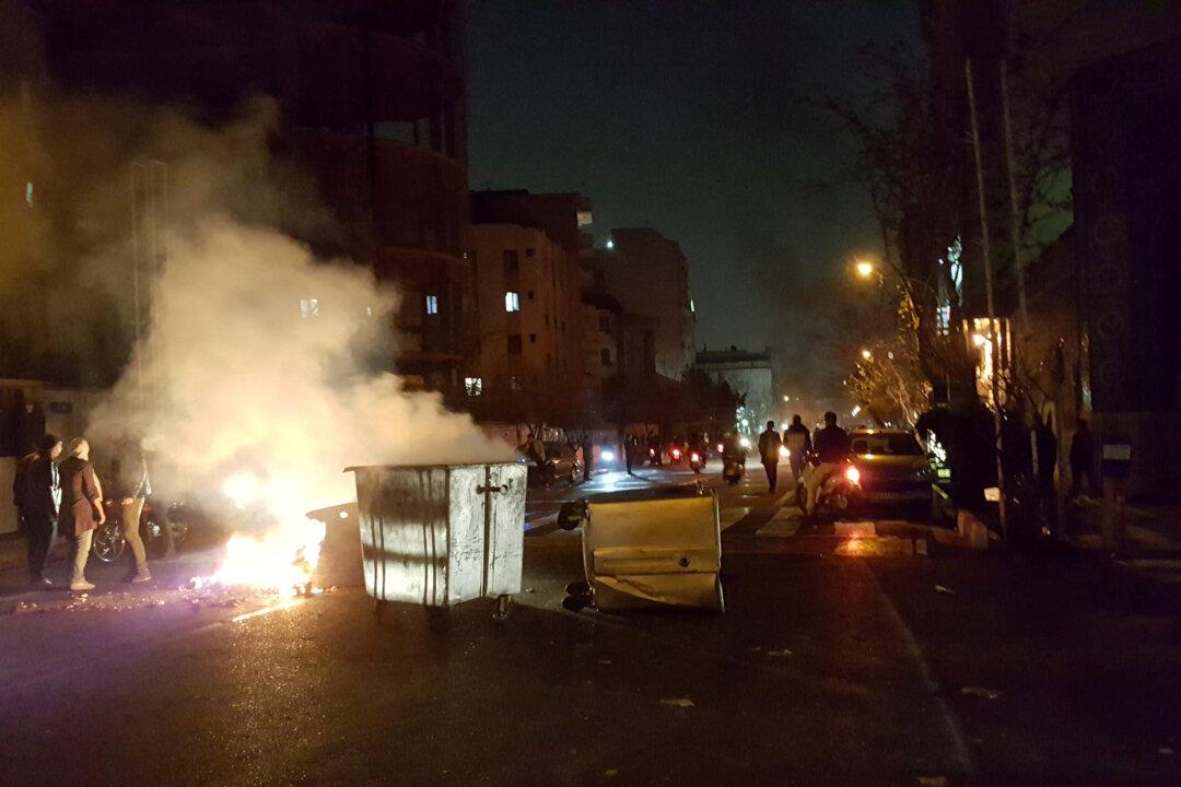 Protests hit Tehran, two demonstrators reported killed in Iran town
