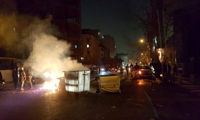 Protests hit Tehran, two demonstrators reported killed in Iran town