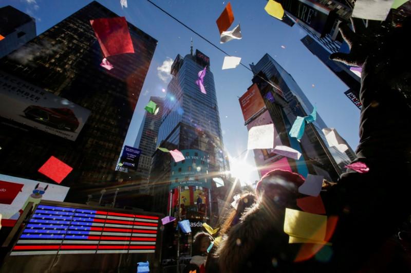 Bright Lights of Times Square Beckon, Even on a Frigid New Year’s Eve