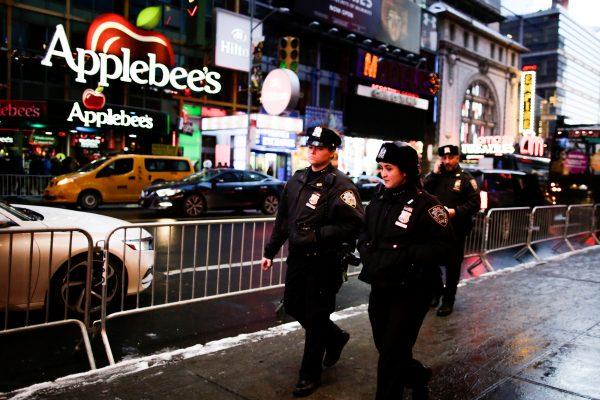 New York Police Department (NYPD) officers walk around Times Square ahead of New Year's Eve celebrations in Manhattan, New York, U.S. December 30, 2017. (Reuters/Eduardo Munoz)