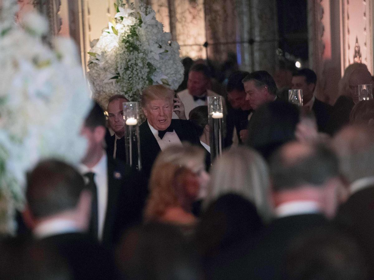 President Donald Trump attends a New Year's party at his Mar-a-Lago resort in Palm Beach, Florida, on Dec. 31, 2017. (NICHOLAS KAMM/AFP/Getty Images)