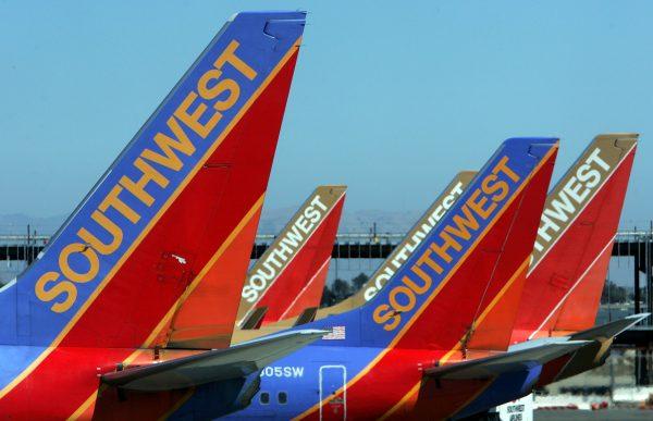 The tail sections of a Southwest Airlines planes are seen at the Oakland International Airport in Oakland, California on July 11, 2005. (Justin Sullivan/Getty Images)