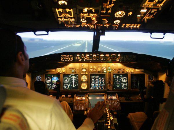 A flying instructor from Indian airline Jet Airways demonstrates a Full Flight Simulator for Boeing 737-800 aircraft in Mumbai Nov. 22, 2005. (Indranil Mukerjee/AFP/Getty Images)