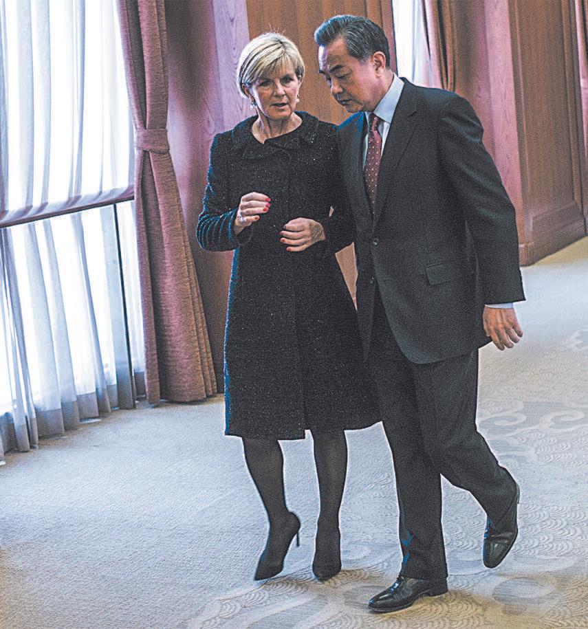 Australian Foreign Minister Julie Bishop speaks with Chinese Foreign Minister Wang Yi in Beijing on Feb. 17, 2016. (FRED DUFOUR/AFP/GETTY IMAGES)