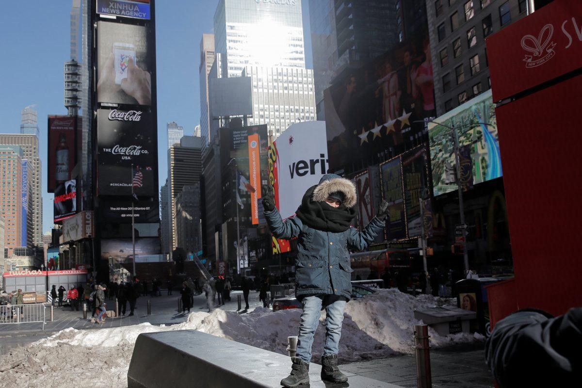 A child poses for a photograph in Times Square in New York City, New York, U.S., Jan. 7, 2018. (Reuters/Elizabeth Shafiroff)