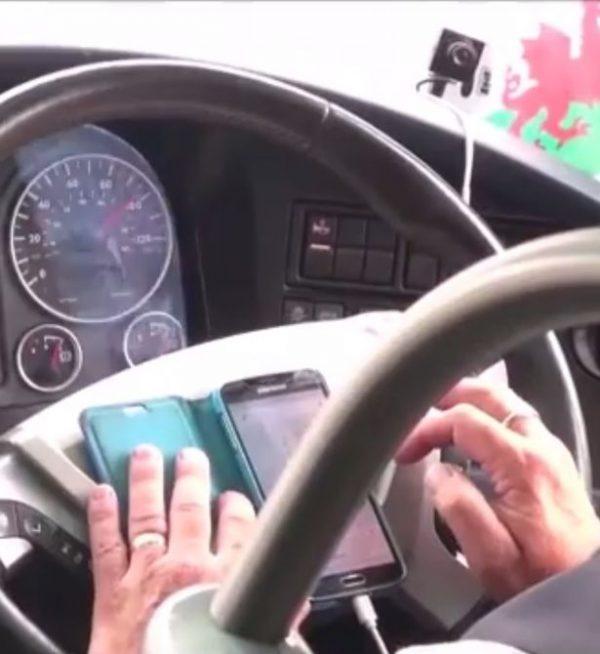 A screenshot of the video shows the driver looking operating his phone. (Daily Post/William Jones)