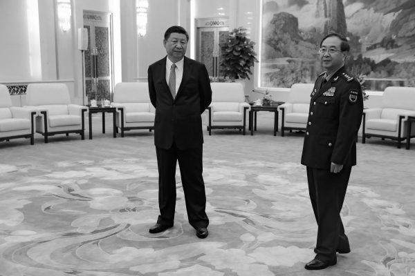Chinese leader Xi Jinping (L) and top general Fang Fenghui at the Great Hall of the People in Beijing on August 17, 2017. (Andy Wong/AFP/Getty Images)