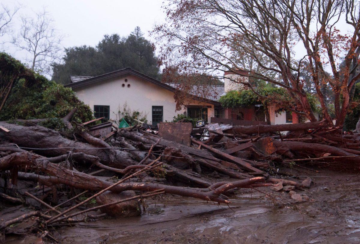 A home seen surrounded by flooded water and debris after a mudslide in Montecito, California, U.S. Jan. 9, 2018. (Kenneth Song/Santa Barbara News-Press via Reuters)