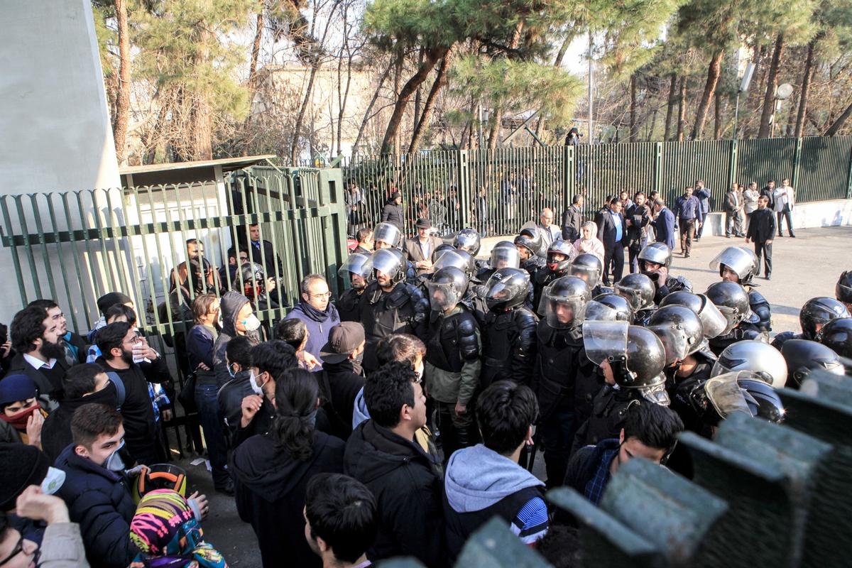 Students and police face off at the University of Tehran during a demonstration in Iran's capital, Tehran, on Dec. 30, 2017. (STR/AFP/Getty Images)