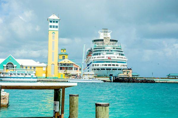 A huge cruise ship in Nassau Harbour dwarfs the ashram's shuttle boat. (Carole Jobin)