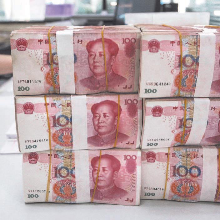Renminbi notes in a bank in Lianyungang, Jiangsu Province, China, on Aug. 11, 2015. (STR/AFP/Getty Images)