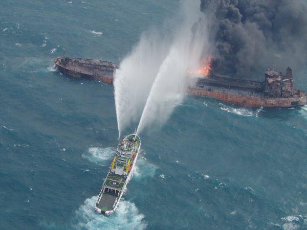 A rescue ship works to extinguish the fire on the stricken Iranian oil tanker Sanchi in the East China Sea, on Jan. 10, 2018 in this photo provided by Japan’s 10th Regional Coast Guard. (10th Regional Coast Guard Headquarters/Handout via REUTERS)