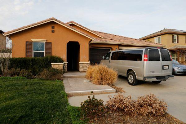 A van sits parked on the driveway of the home of David Allen Turpin and Louise Ann Turpin in Perris, Calif., on Jan. 15, 2018. (Reuters/Mike Blake)