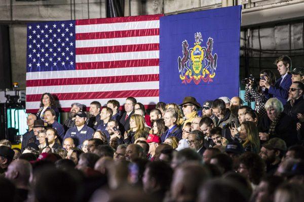 Audience members listen to President Donald Trump speak at H&K Equipment in Coraopolis, Penn., on Jan. 18, 2018. (Charlotte Cuthbertson/The Epoch Times)