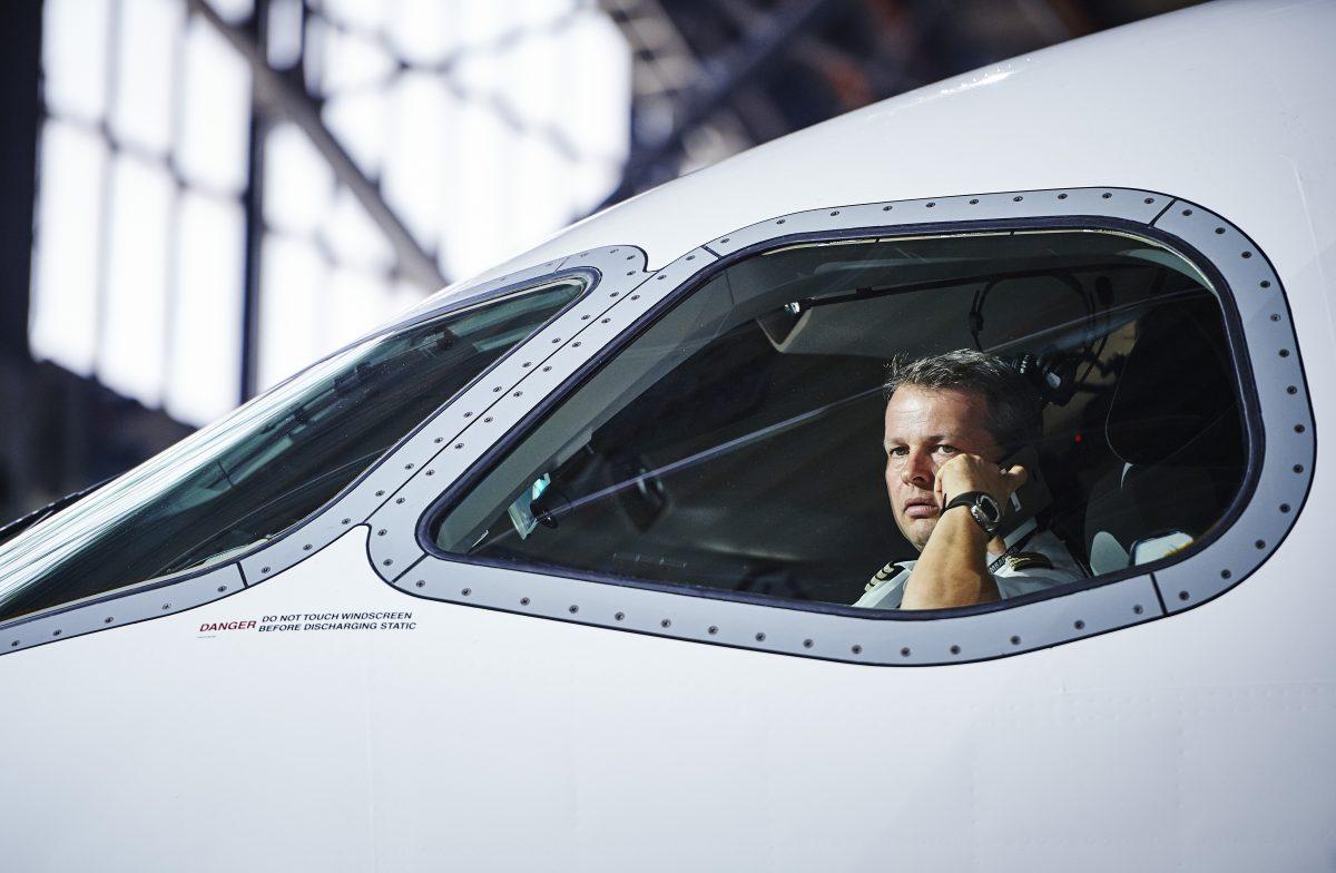 A pilot sits inside a passenger jetliner on July 6, 2016. (MICHAEL BUHOLZER/AFP/Getty Images)