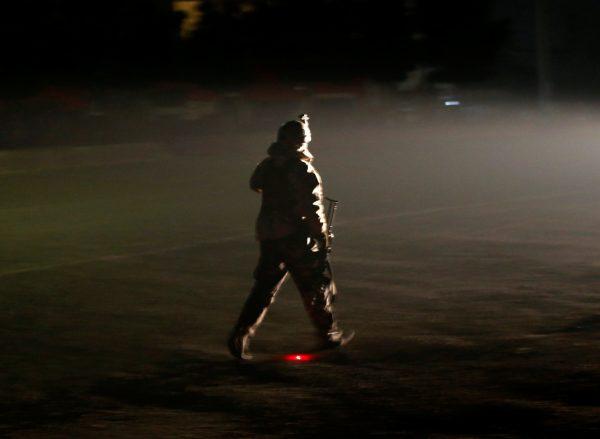 A member of the Afghan security forces arrives the site of an attack on the Intercontinental Hotel in Kabul, Afghanistan January 20, 2018. (Reuters/Omar Sobhani)