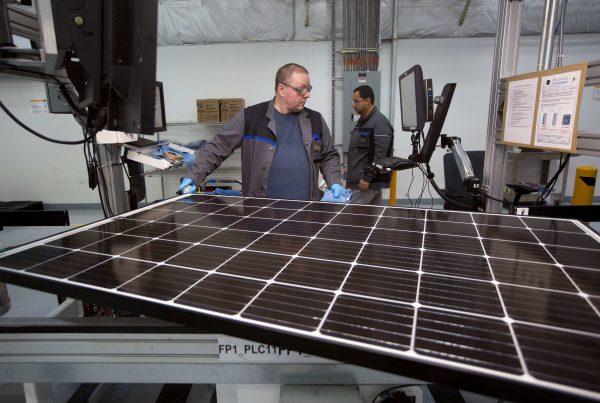 Production operator John White checks a panel at the SolarWorld solar panel factory in Hillsboro, Oregon, U.S., Jan. 15, 2018. (Reuters/Natalie Behring)