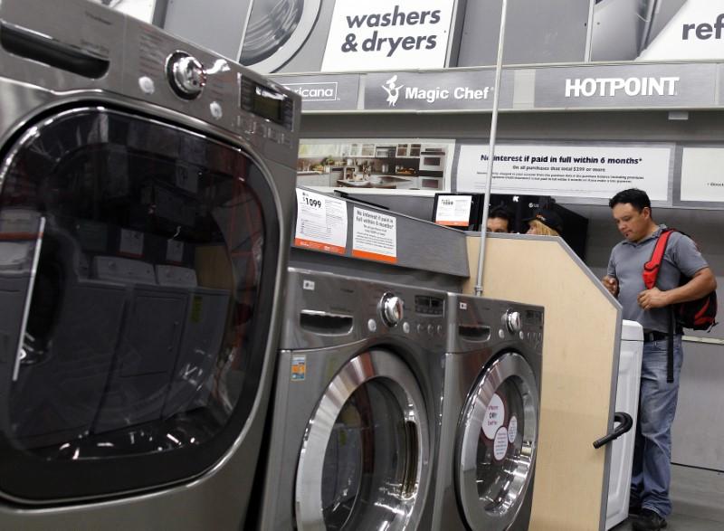 Shoppers look at washers and dryers at a Home Depot store in New York, July 29, 2010. (Reuters/Shannon Stapleton)