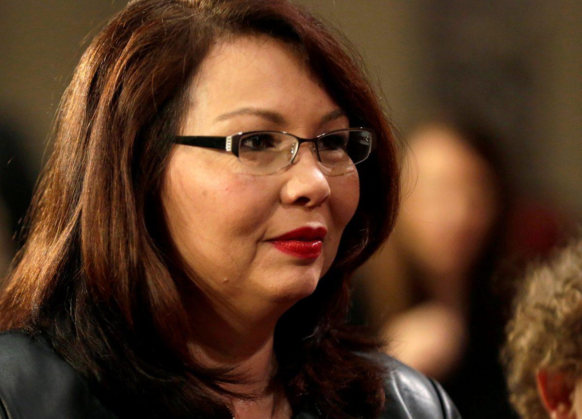 Sen. Tammy Duckworth (D-Ill.) participates in a mock swearing-in with U.S. Vice President Joe Biden during the opening day of the 115th Congress on Capitol Hill in Washington, U.S., Jan. 3, 2017. (Reuters/Joshua Roberts/File Photo)